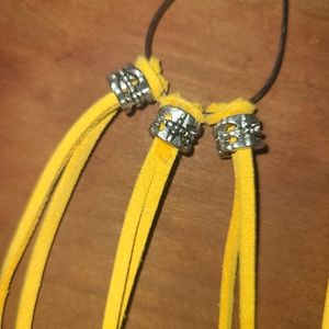 Handmade leather and silver earrings.